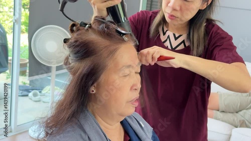 Wallpaper Mural The East Asian senior woman is getting her hair styled at the salon. Torontodigital.ca