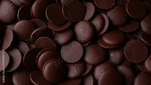 Dark Chocolate COUVERTURE chips Pistols buttons. Confection and pastry concept.