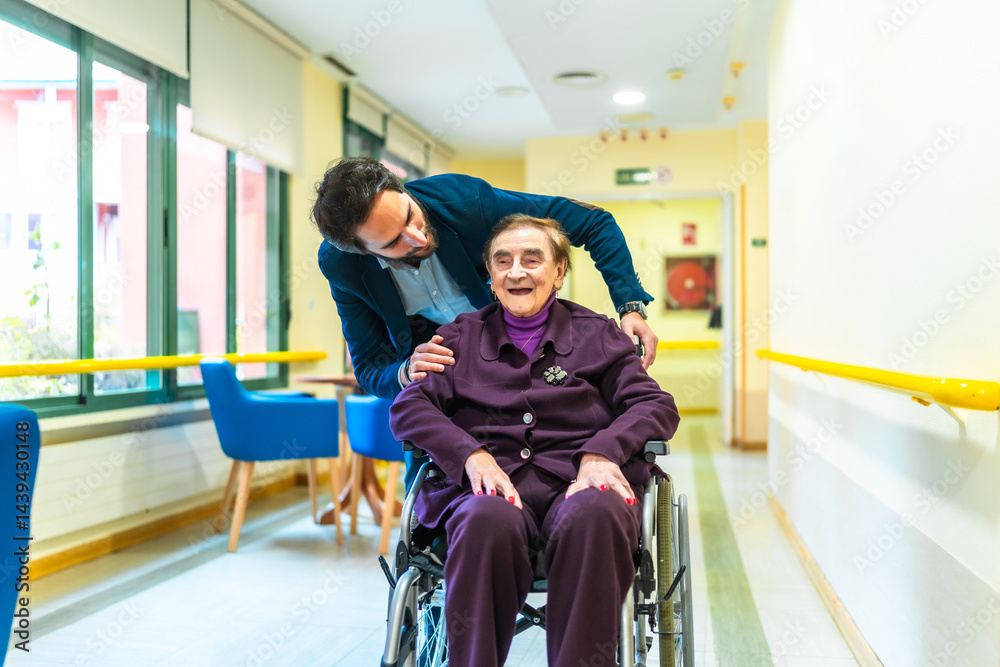 Nurse assisting elderly woman in wheelchair at retirement home