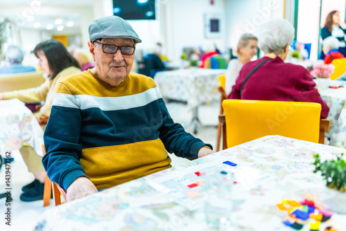 Obraz na płótnie Elderly man enjoying recreational activities in nursing home w salonie