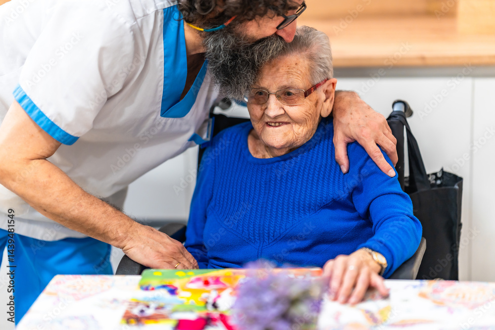 Nurse showing affection to elderly woman in wheelchair at nursing home
