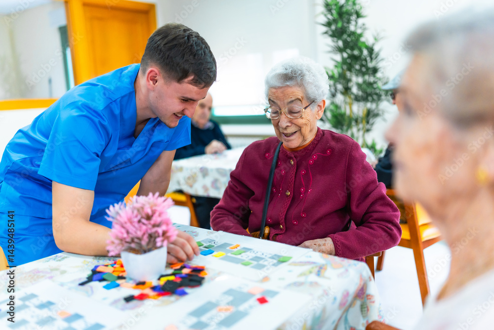 Male nurse assisting elderly woman playing board game in nursing home