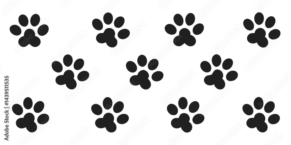 Fototapeta premium Set of black paw prints animal tracks on a white background