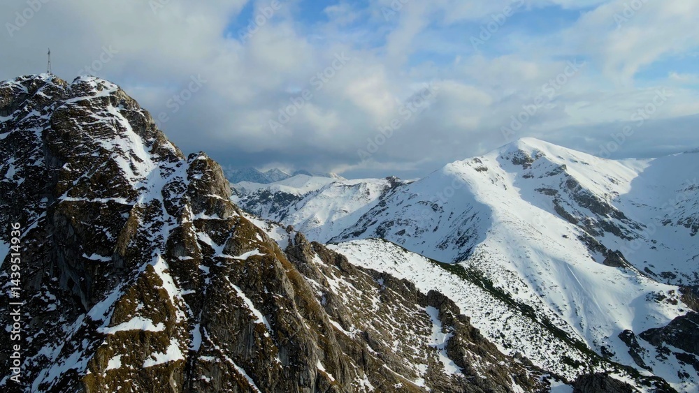 Snow capped mountain peak rocks glacier view from above Zakopane Poland