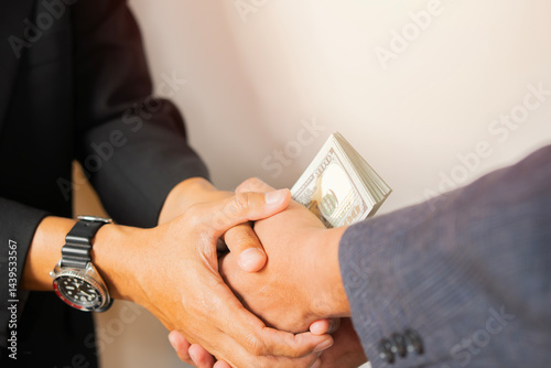 Handing stacks of money to each other in the office, Give money to officials for some business-related reason