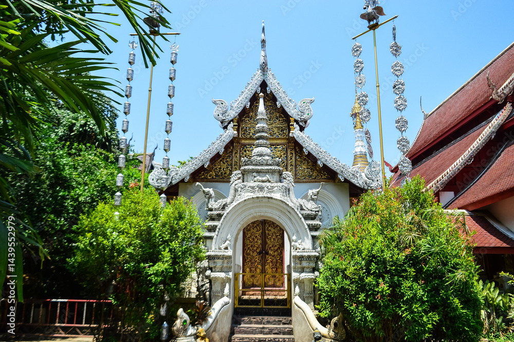 Naklejka premium Chapel, Lanna Architecture, Symbols of Buddhism, South East Asia at Wat Maha Wan, Chiang Mai, Northern Thailand