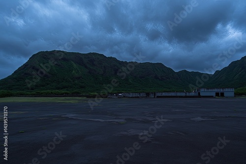Misty mountain range, darkened runway photo