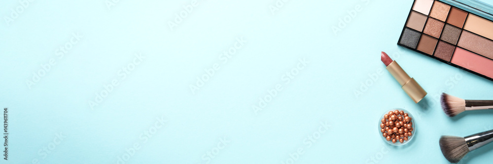 Cosmetic palette, brushes and lipstick. Web banner format.