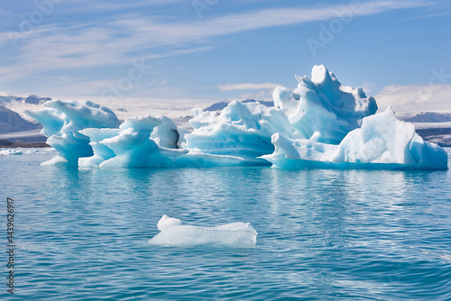 Icebergs turquoise lake and snowy mountains. Jokulsarlon, Southeast area. Iceland.