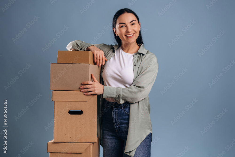 Bunch of boxes, moving concept. Beautiful woman is against background Bunch of boxes, moving concept. Beautiful woman is against background
