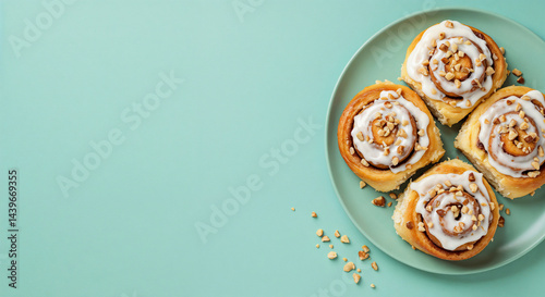 Delicious Cinnamon Rolls, Overhead, Displayed on Plate, against Teal Background with Copy Space