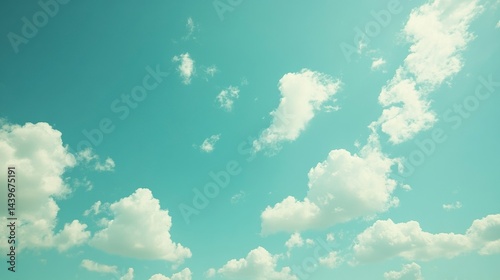 Peaceful Blue Sky with Soft White Clouds in Clear Daylight