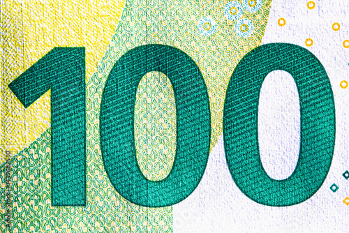 Obraz na płótnie Macro image of one hundred Euro, as a symbol of one of the most stable and strongest currencies in the world. w salonie