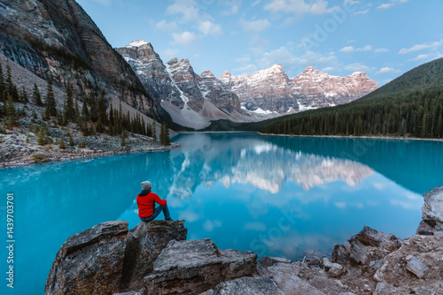 Man sitting near Moraine lake, Banff, Canada