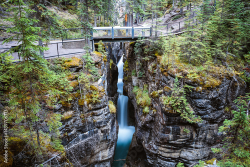 Bridge over creek with waterfall, Maligne Canyon, Jasper National Park, Canada
