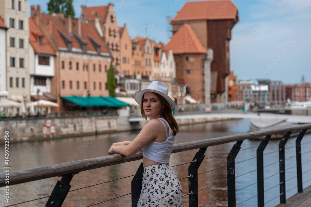 girl in a white hat on the background of the city of Gdansk Poland Europe