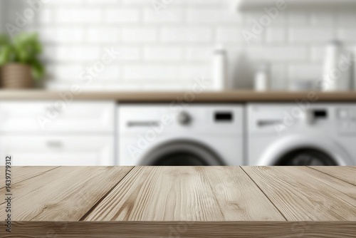 Empty horizontal wooden table for product placement in a laundry room. Flat blank tabletop surface for product display montage or counter with a blurred washing machine background. Fresh laundry.