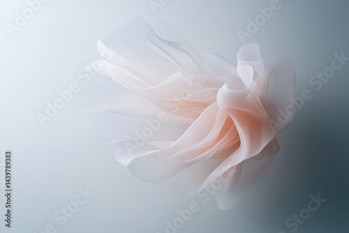 Light pink transparent smooth fabric flowing on light blue background