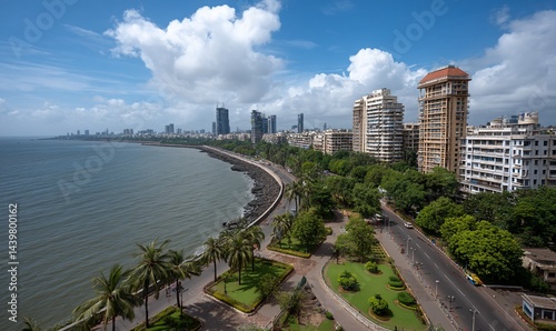 Panoramic view of Mumbai's coastline, city skyline, and gardens under a partly cloudy sky. Ideal for showcasing urban landscapes, tourism, and city life
