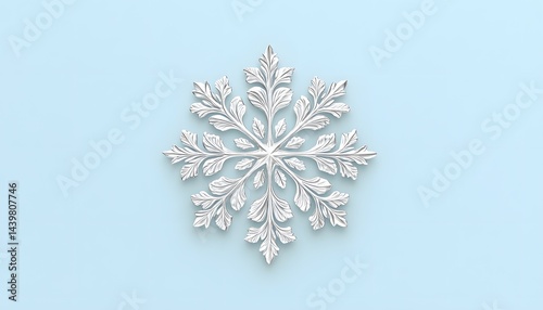 Detailed white snowflake ornament centered against light blue background