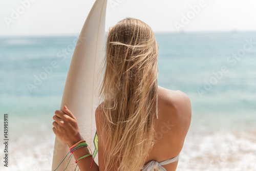 Passionate Female Surfer Looking at the Waves