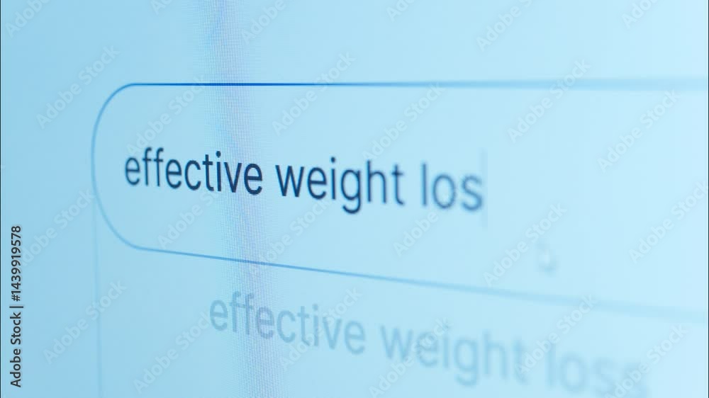 Close up revealing weight loss search term gradually appearing on screen, representing digital exploration of health improvement strategies and online information gathering Close up revealing weight loss search term gradually appearing on screen, representing digital exploration of health improvement strategies and online information gathering
