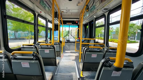 Interior view of an empty public bus showcasing modern seating and bright lighting