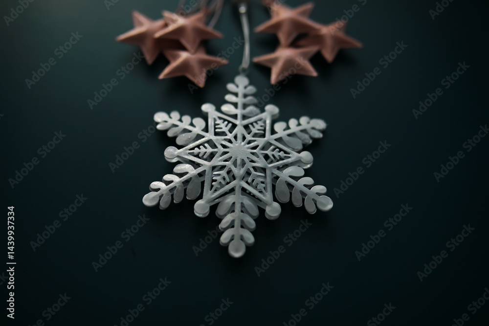 White Snowflake Ornament with Pink Stars on Dark Background for Christmas Decoration White Snowflake Ornament with Pink Stars on Dark Background for Christmas Decoration