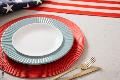 Obraz na płótnie Table setting for USA Independence Day. Festive dinner with empty plate and decoration in USA national flag colors. Happy Memorial Day. Close up. w salonie