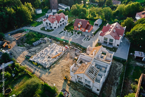 Obraz na płótnie Aerial view of residential neighborhood with modern houses and construction site. Concept of real estate development and suburban living w salonie