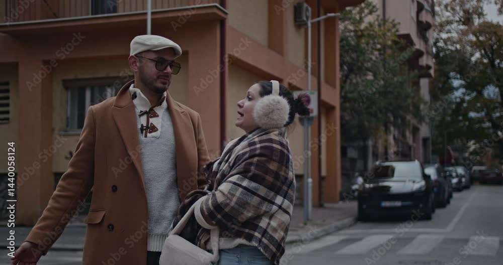 A stylish couple enjoys a leisurely stroll through the city on an autumn day, sharing laughter and conversation. A stylish couple enjoys a leisurely stroll through the city on an autumn day, sharing laughter and conversation.