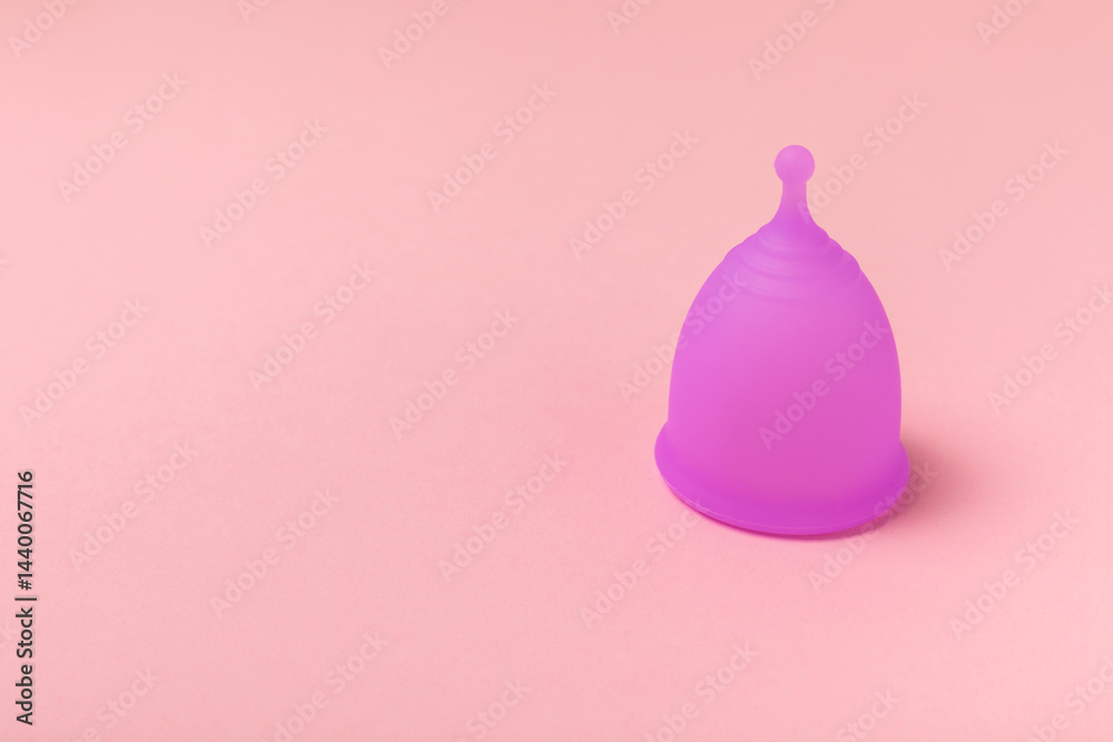 Menstrual cup on a bright background. Sanitary napkins, tampons and menstrual cup.Concept of critical days, menstruation.feminine hygiene product. Women health concept.Premenstrual syndrome.Copy space