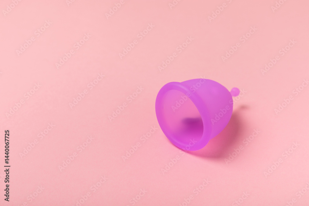Menstrual cup on a bright background. Sanitary napkins, tampons and menstrual cup.Concept of critical days, menstruation.feminine hygiene product. Women health concept.Premenstrual syndrome.Copy space