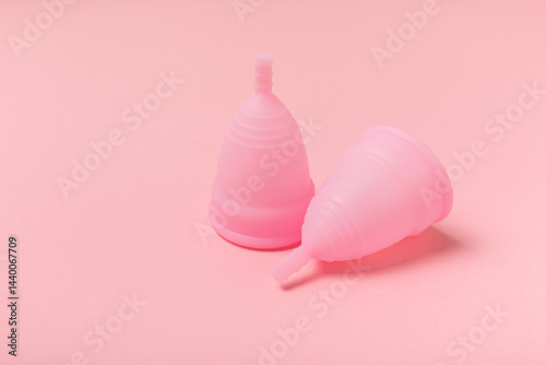 Obraz na płótnie Menstrual cup on a bright background. Sanitary napkins, tampons and menstrual cup.Concept of critical days, menstruation.feminine hygiene product. Women health concept.Premenstrual syndrome.Copy space w salonie