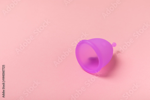 Obraz na płótnie Menstrual cup on a bright background. Sanitary napkins, tampons and menstrual cup.Concept of critical days, menstruation.feminine hygiene product. Women health concept.Premenstrual syndrome.Copy space w salonie