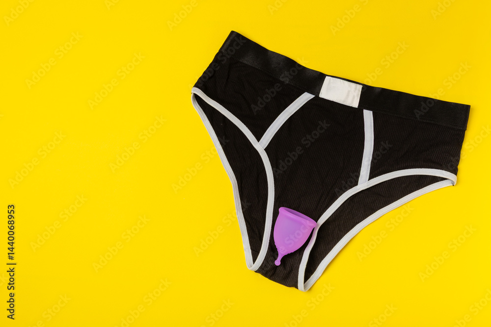 Menstrual cup on a bright background. Sanitary napkins, tampons and menstrual cup.Concept of critical days, menstruation.feminine hygiene product. Women health concept.Premenstrual syndrome.Copy space