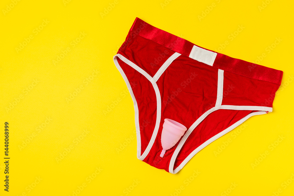 Menstrual cup on a bright background. Sanitary napkins, tampons and menstrual cup.Concept of critical days, menstruation.feminine hygiene product. Women health concept.Premenstrual syndrome.Copy space