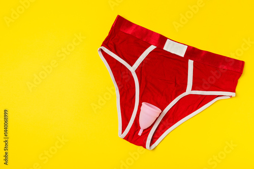 Obraz na płótnie Menstrual cup on a bright background. Sanitary napkins, tampons and menstrual cup.Concept of critical days, menstruation.feminine hygiene product. Women health concept.Premenstrual syndrome.Copy space w salonie