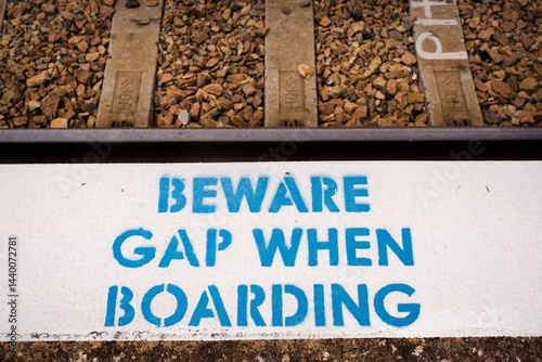 Warning sign to beware the gap at Harden railway station