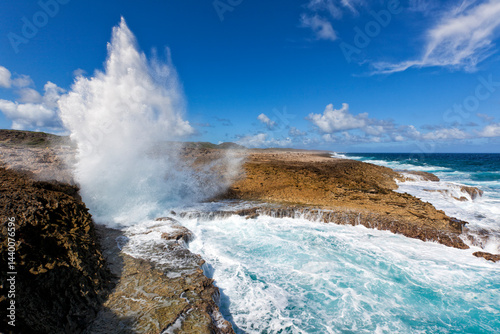 Fototapeta Naklejka Na Ścianę i Meble -  Waves crashing into Boka Pistol bay, Shete Boka National Park, Curacao