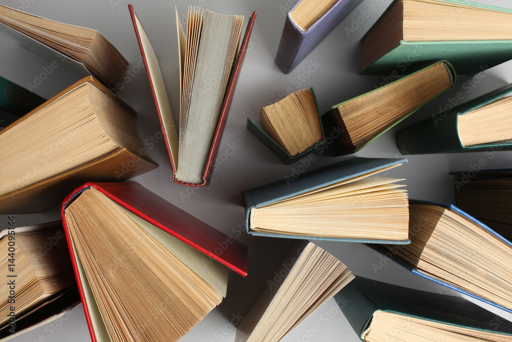 Obraz premium Open book, hardback colorful books on table. Back to school. Copy space for text. Education business concept