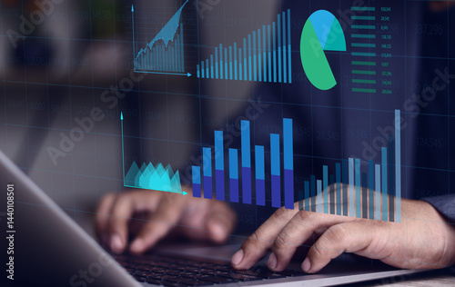 Financial graphs and table calculations. Businessman using laptop computer to analyze business terms, business management analysis using spreadsheet software, finance.
