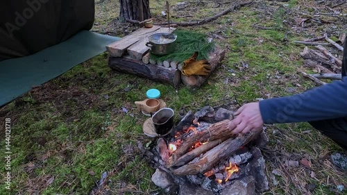 Making a drink on a fire in the forest. Tea. Coffee on the fire.