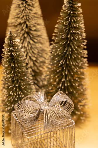 Obraz na płótnie Silver christmas gift and decorative christmas trees creating festive atmosphere w salonie