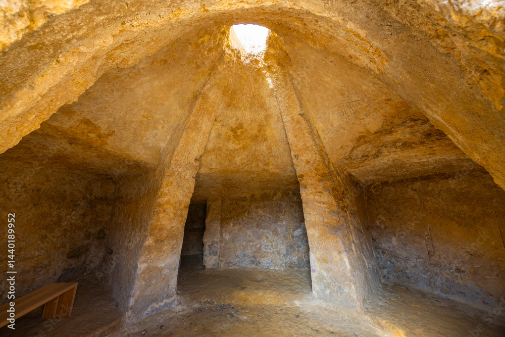Interior of a tholos tomb showing corbelled dome and columns in Carmona, Spain