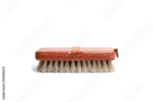 A leather brush with bristles isolated on a white background