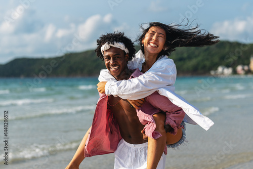 Obraz na płótnie Romantic interracial couple enjoying a tropical honeymoon on a beach, embracing love and happiness w salonie