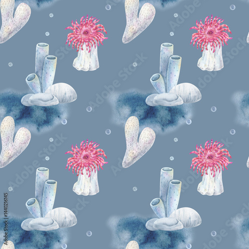 Seamless watercolor pattern of coral reef elements with with pink sea anemones, tube sponges, and sea stones on a blue background. Perfect for marine designs, fabrics, and packaging.
