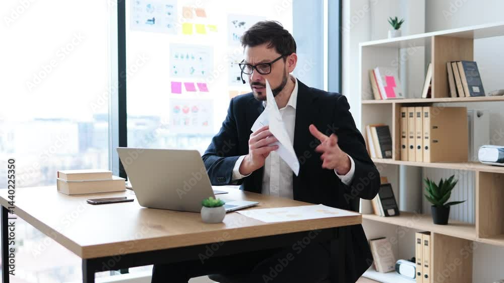 Young adult man presenting data charts during virtual business meeting, professional remote communication. Young adult man presenting data charts during virtual business meeting, professional remote communication.