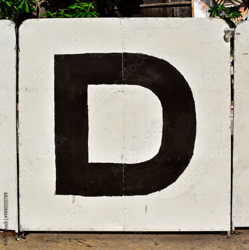 Letter D in black on a white board, Rio de Janeiro, Brazil